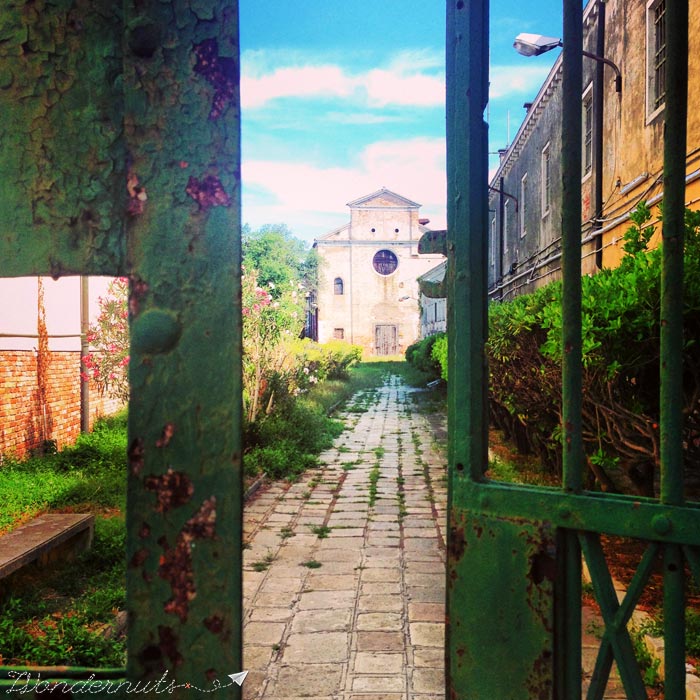 This gate, slightly ajar, in Venice, Italy, has us thinking about lots of things. But first, where does it go?